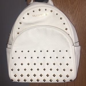 Michael Kors white backpack purse with studs.